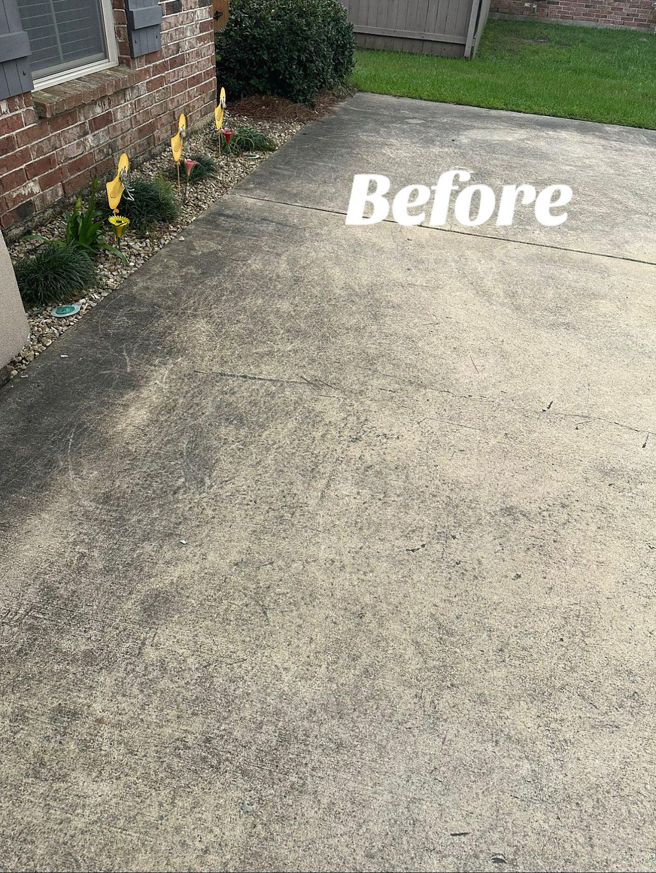 Driveway before pressure washing